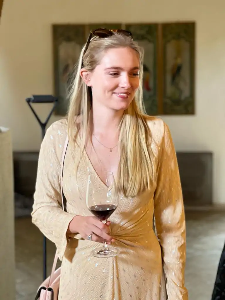 sicilian luxury yoga retreats wine tasting. Beautiful girl holding a wine glass of red wine