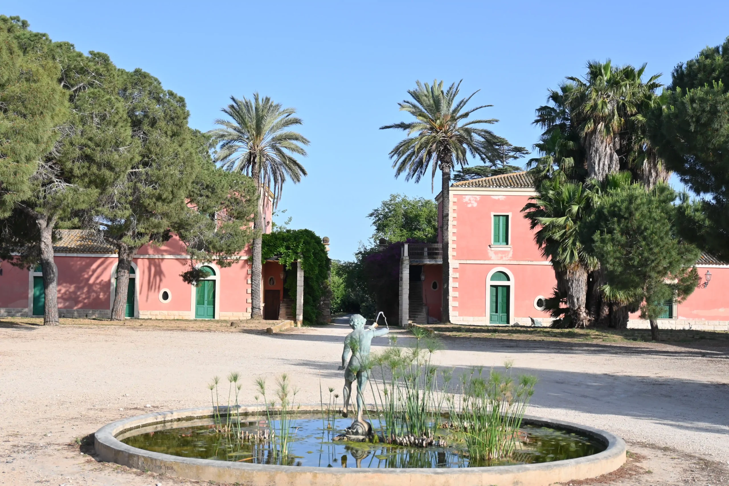 corporate events a view of the villas and fountains in Dorilli with the palm tree