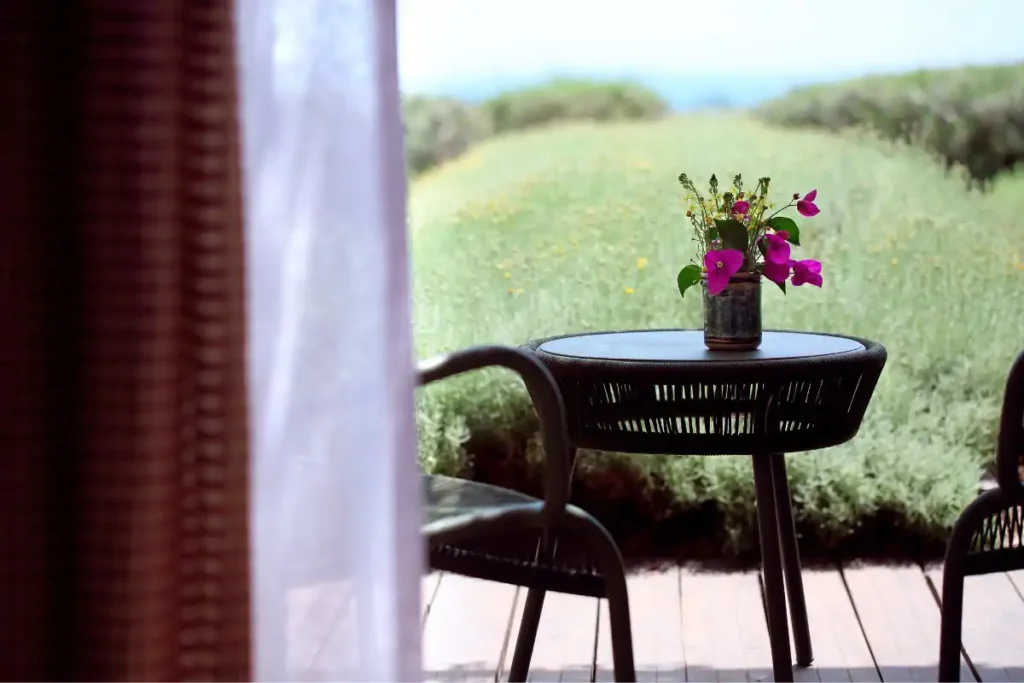 A vase with sicilian flowers on the table for a private space for the guests sicily luxury yoga retreat